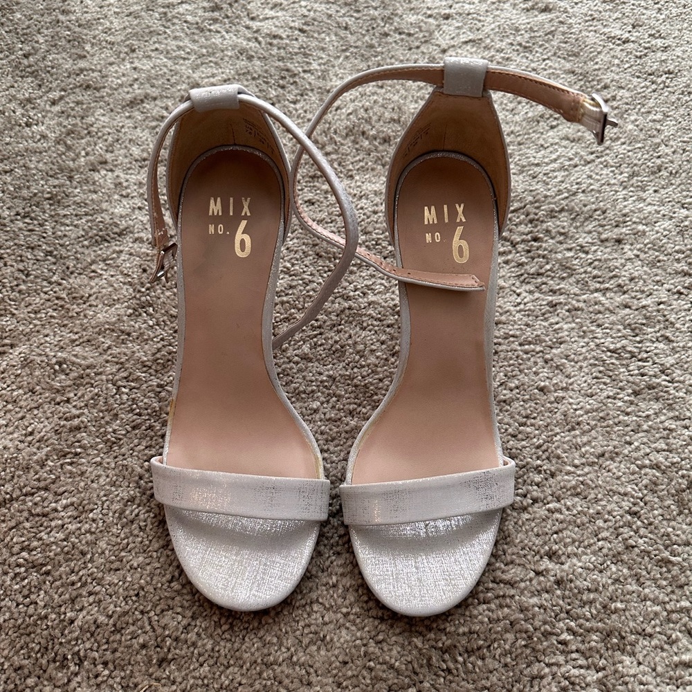 Silver Heels. Minor wear on soles.